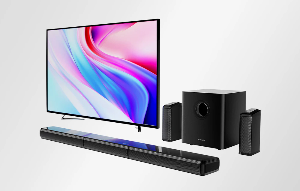 Sistem home theater cu bară de sunet, subwoofer, două difuzoare și televizor.
