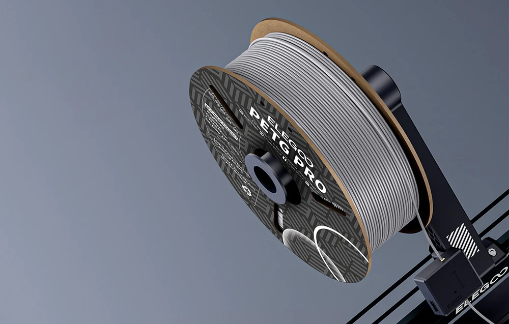 mosor de filament gri montat pe o imprimantă 3D