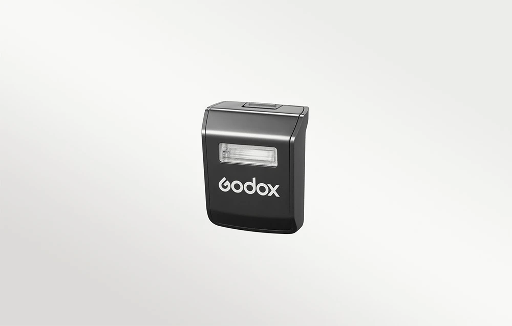 Modul auxiliar detașabil pentru unitatea de bliț Godox, cu logo-ul alb al producătorului pe fundal negru