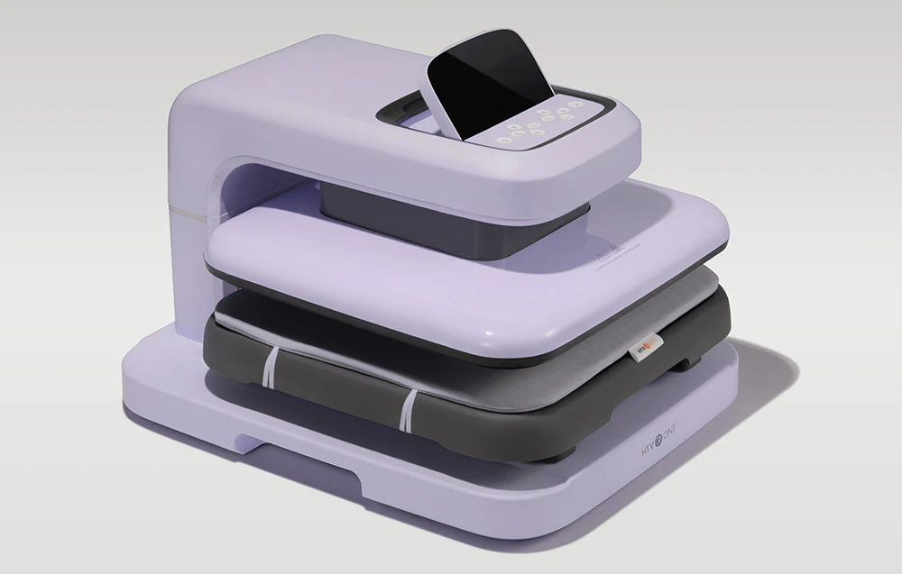 O presă termică automată de culoare violet pastel, așezată pe un fundal deschis și solid.