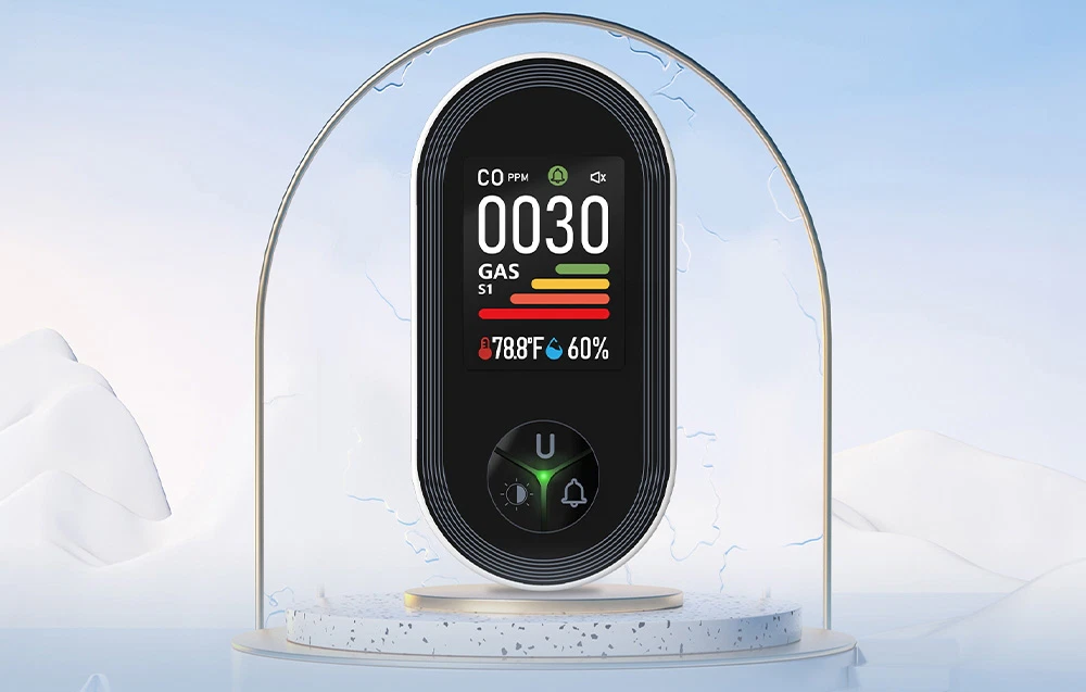 Senzor oval cu afișaj LCD color pe o bază rotundă, cu un munte și un arc de sticlă în fundal
