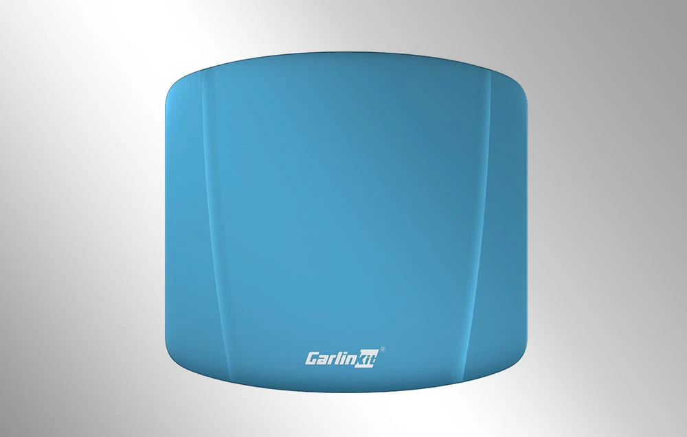 Adaptor wireless Carlinkit TBOX ULTRA în albastru, văzut de sus, pe un fundal deschis.