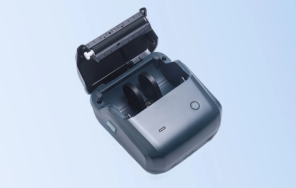 Open blue NIIMBOT thermal printer with visible interior for label roll