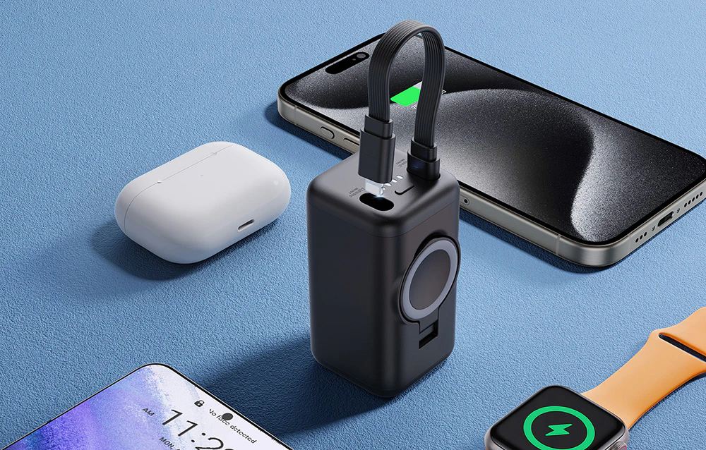 Powerbank pe sol albastru lângă smartphone-uri, smartwatch și căști TWS