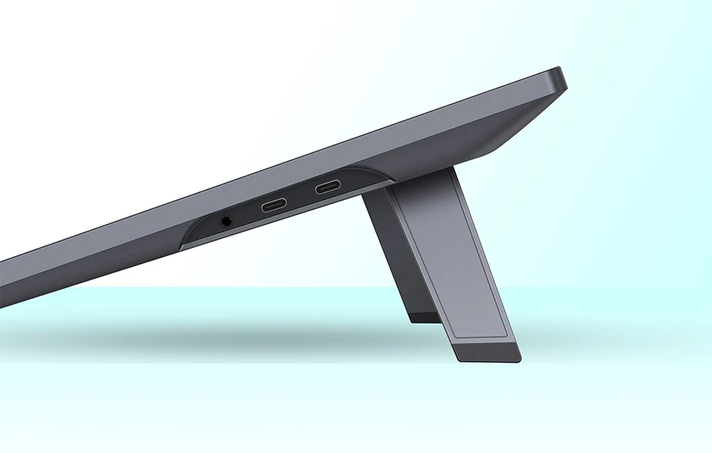 Tabletă grafică Huion cu partea laterală care prezintă porturile USB-C și suportul reglabil