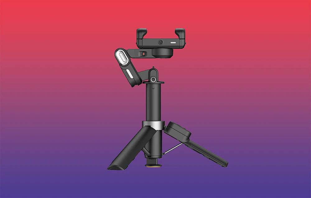 Gimbal montat pe un mini trepied, vedere laterală, pe un fundal cu gradient roșu-violet.