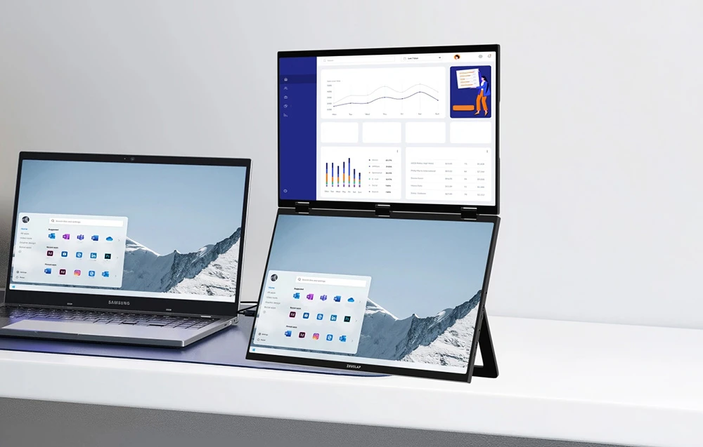 Laptop conectat la monitorul pliabil ZEUSLAP cu două ecrane suplimentare care afișează desktopul și graficele