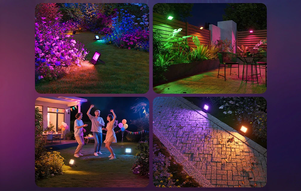 O grădină, o terasă, o casă și o alee în fața casei iluminate de spoturi colorate