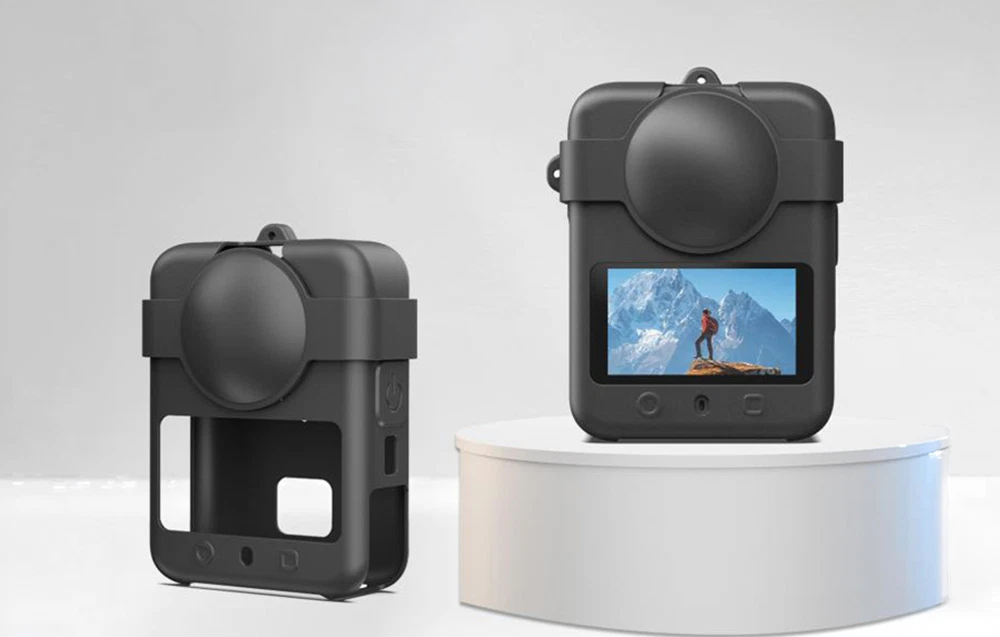 Husă de protecție din silicon și capac pentru obiectiv pentru camera afișată pe o platformă rotundă, albă