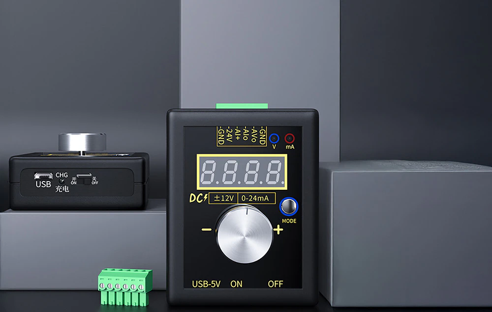 Generator de semnal FNIRSI prezentat pe un set cu blocuri gri, cu accesorii lângă el.