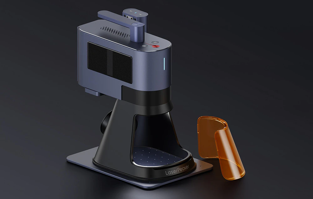 Gravor laser pe fundal gri