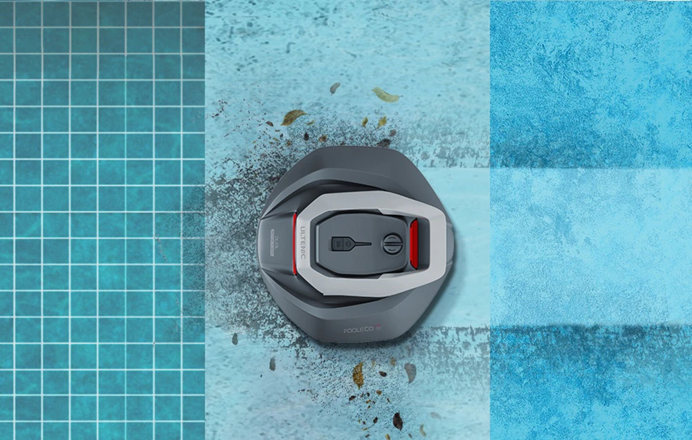 Un robot de curățare a piscinei Ultenic Pooleco 10 de culoare gri, curățând frunzele de pe fundul piscinei de pe diverse suprafețe de gresie